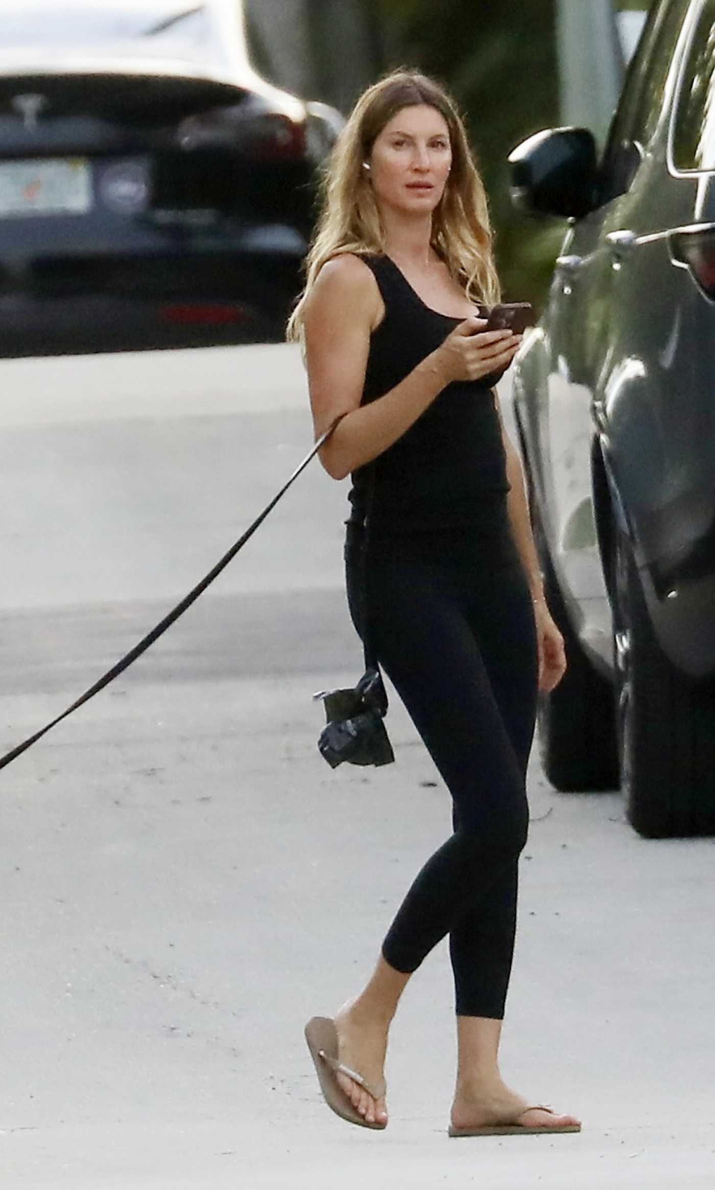 Gisele Bundchen in a Black Tank Top Was Spotted Walking Her Dog in Miami 08/21/2024