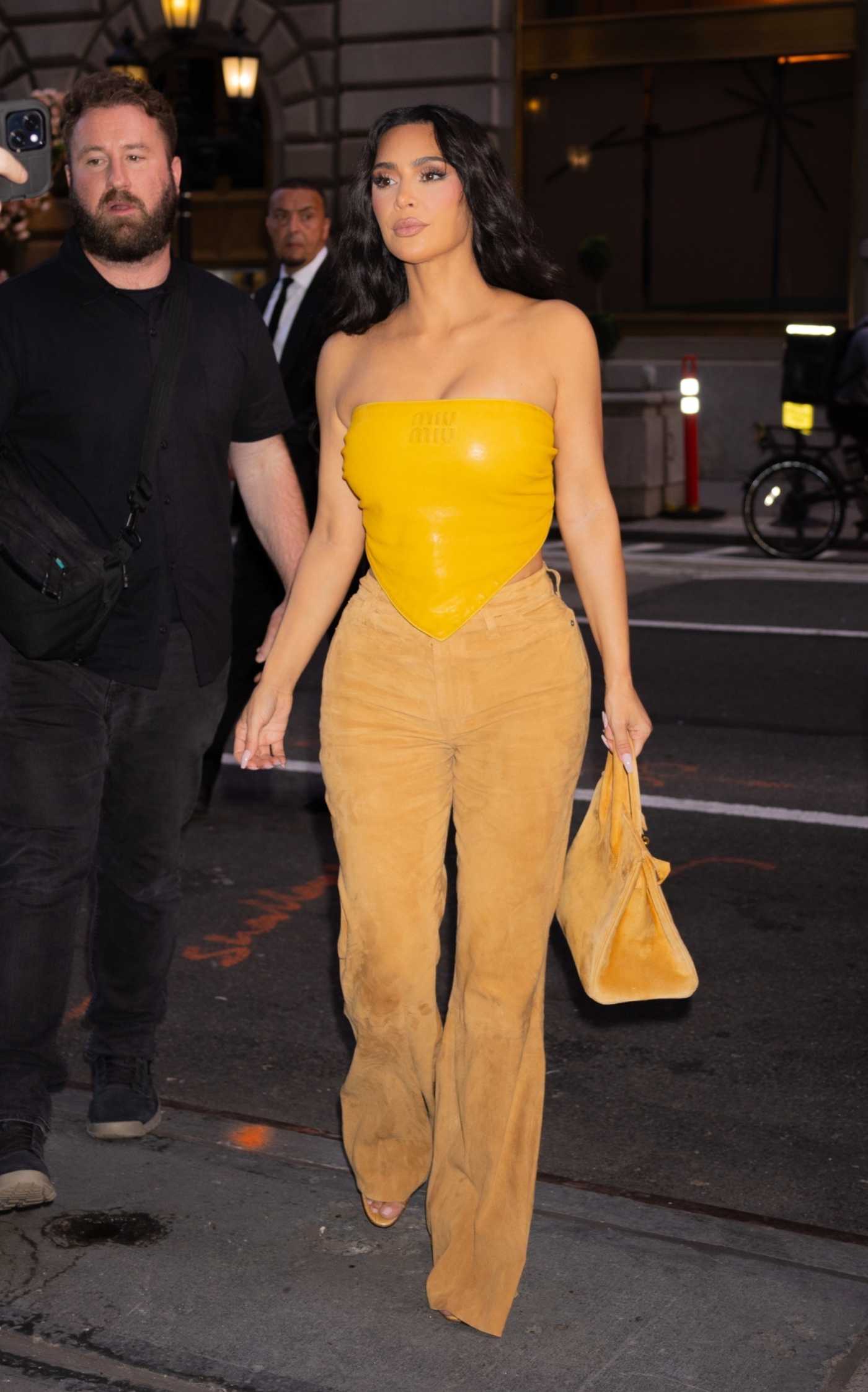 Kim Kardashian in a Yellow Top Arrives at the Polo Bar in New York 08/14/2024