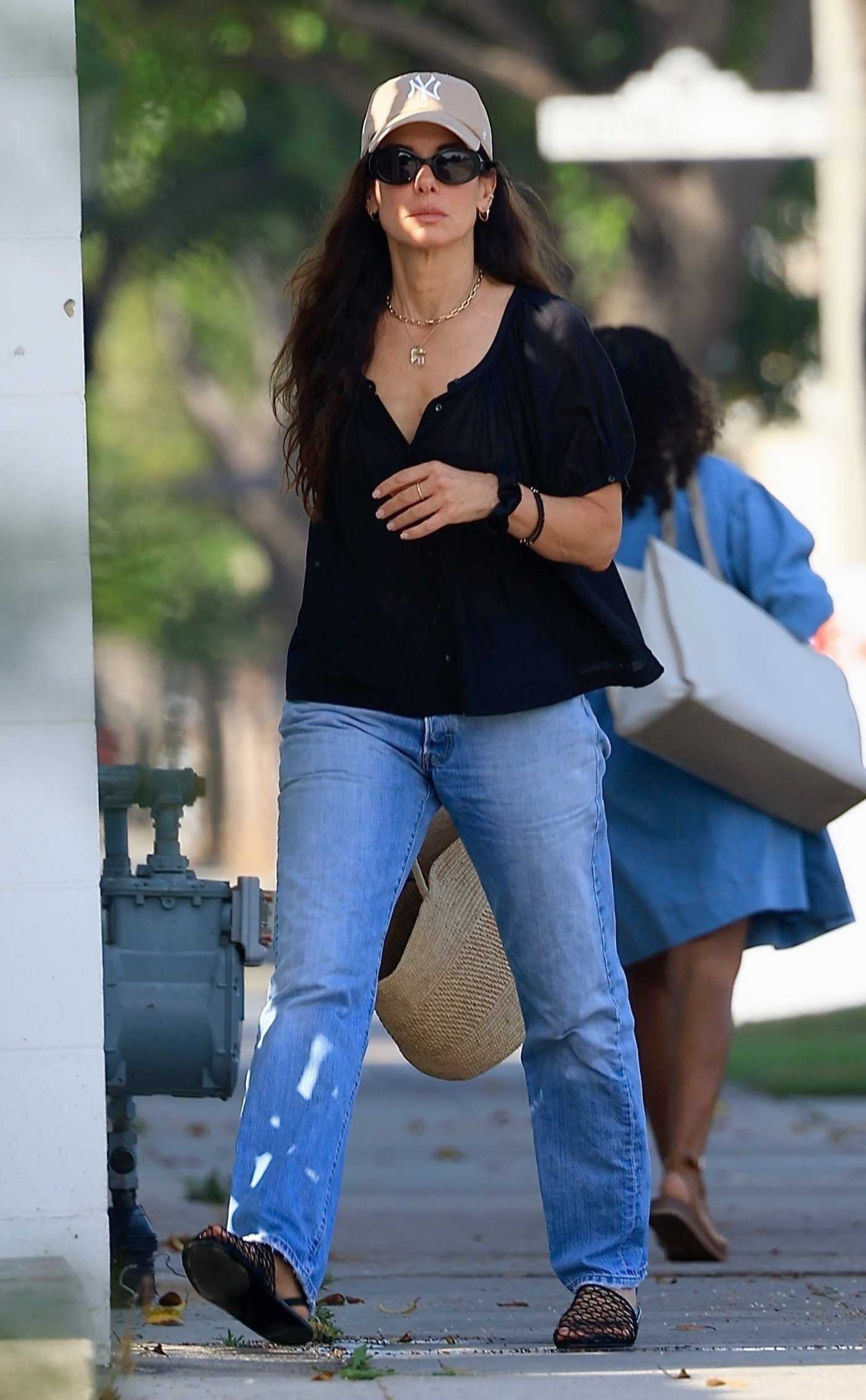 Sandra Bullock in a Beige Cap Leaves a Hair Salon in Beverly Hills 08/07/2024