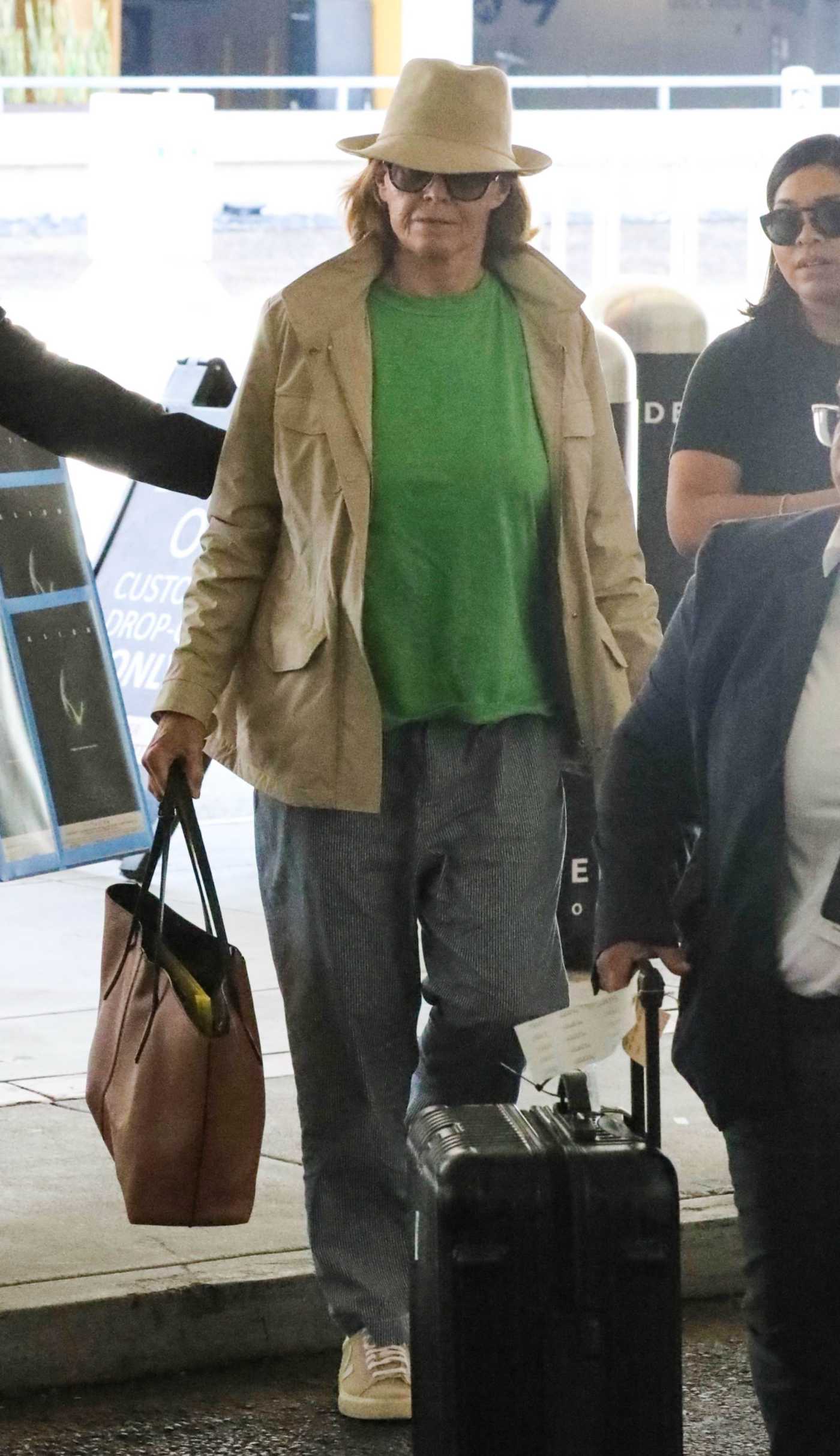 Sigourney Weaver in a Green Tee Catching a Flight Out of LAX Airport in Los Angeles 08/17/2024