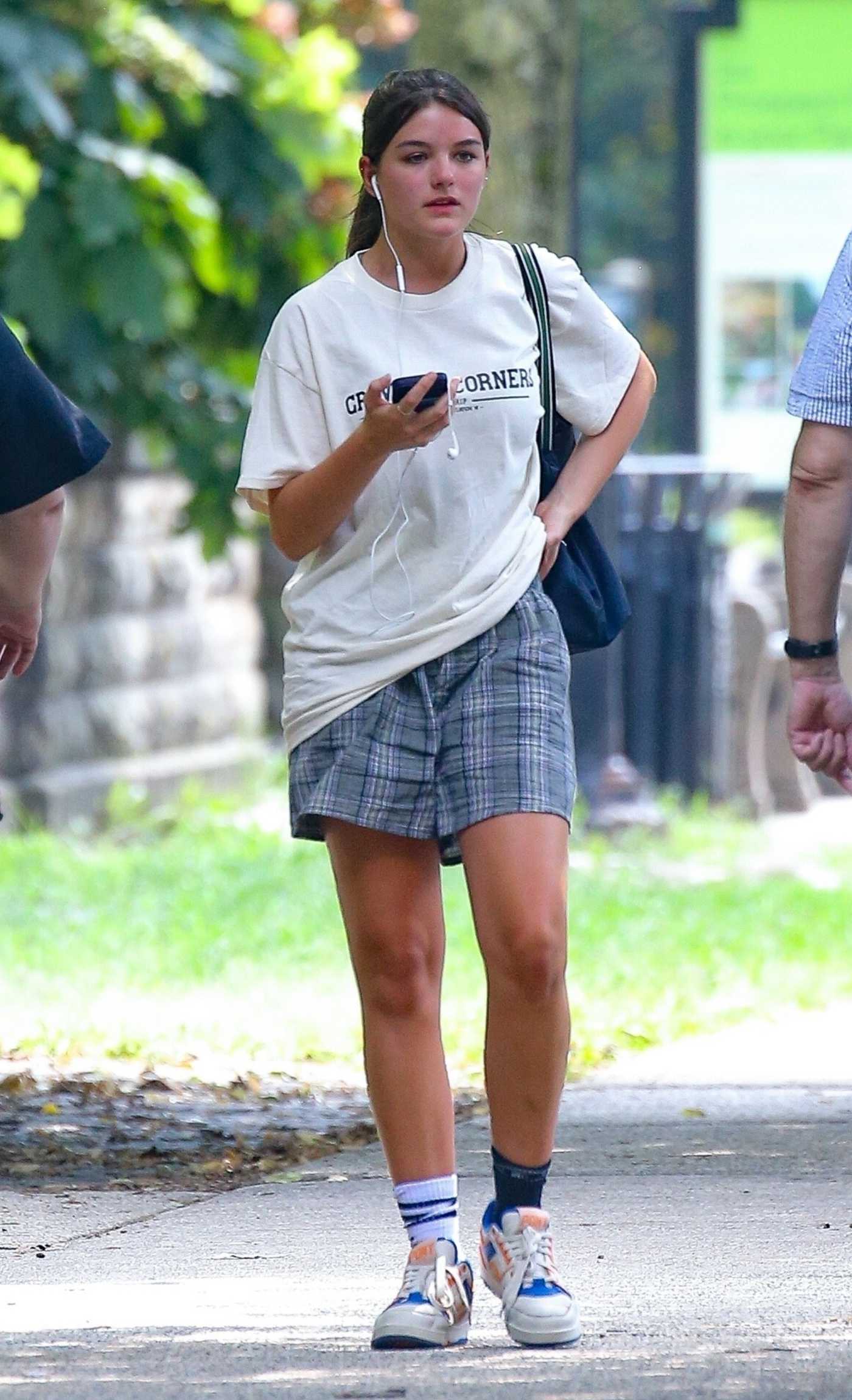 Suri Cruise in a White Tee Enjoys a Solo Stroll Through Central Park in New York 08/14/2024