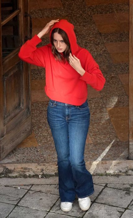 Grace Van Patten in a Red Hoodie