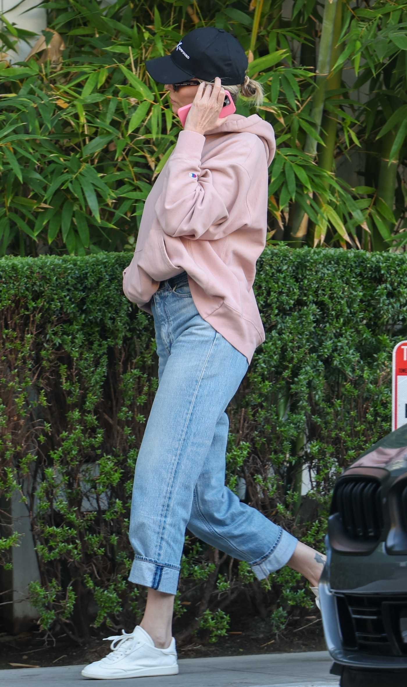 Charlize Theron in a White Sneakers Arrives at San Vicente Bungalows in West Hollywood 11/11/2024