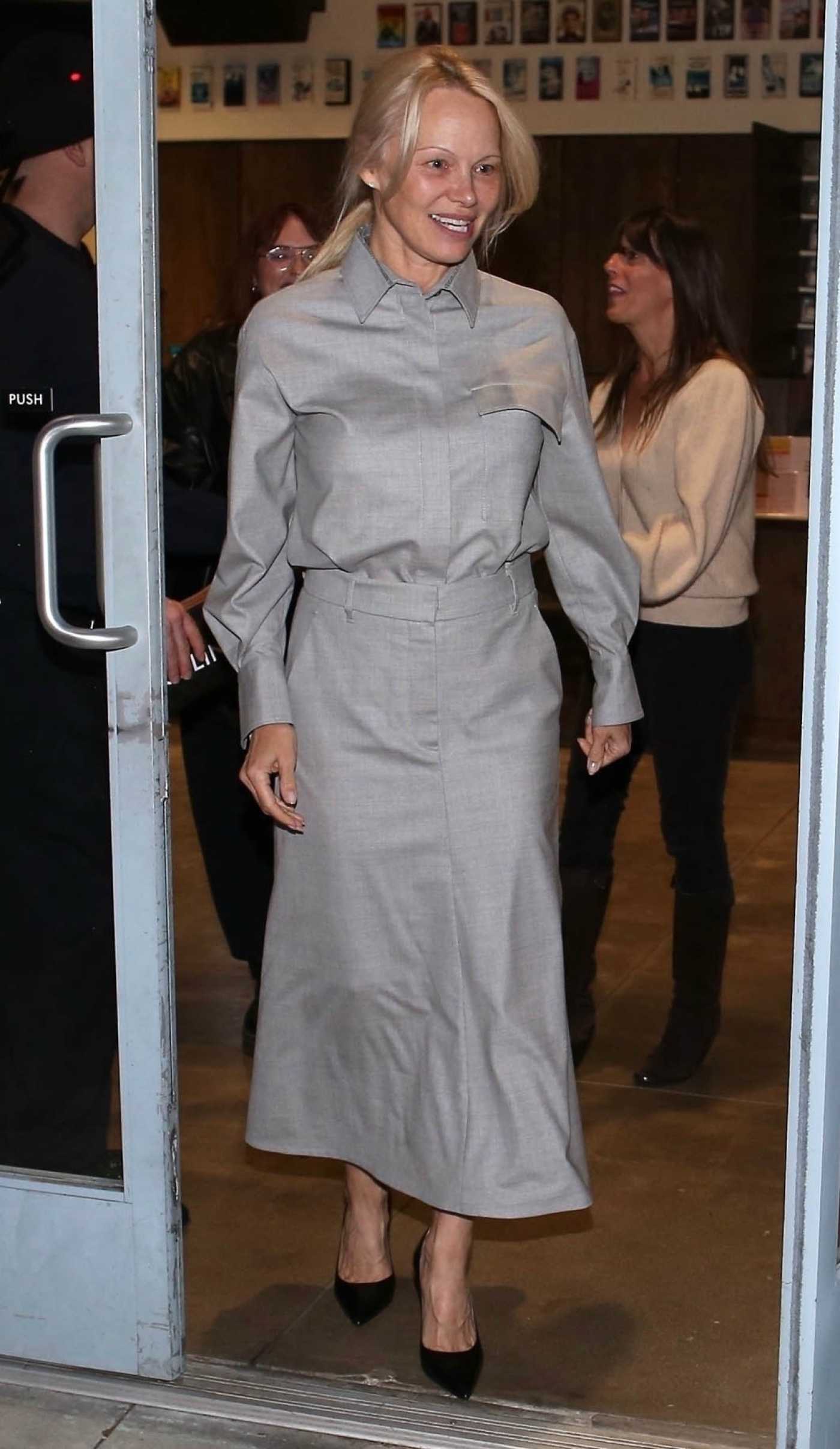 Pamela Anderson in a Grey Ensemble Leaves the Vidiots Eagle Theatre in Los Angeles 11/16/2024