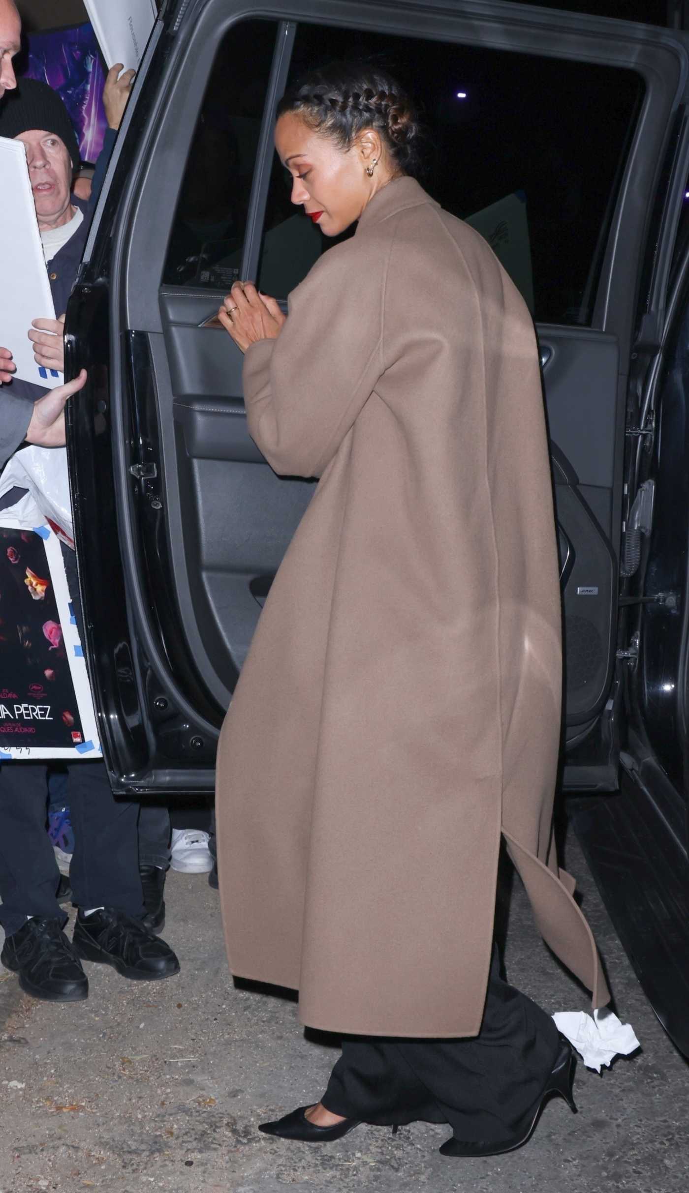 Zoe Saldana in a Tan Coat Arrives at an Emilia Perez Screening at Vista Theater in Los Angeles 11/12/2024