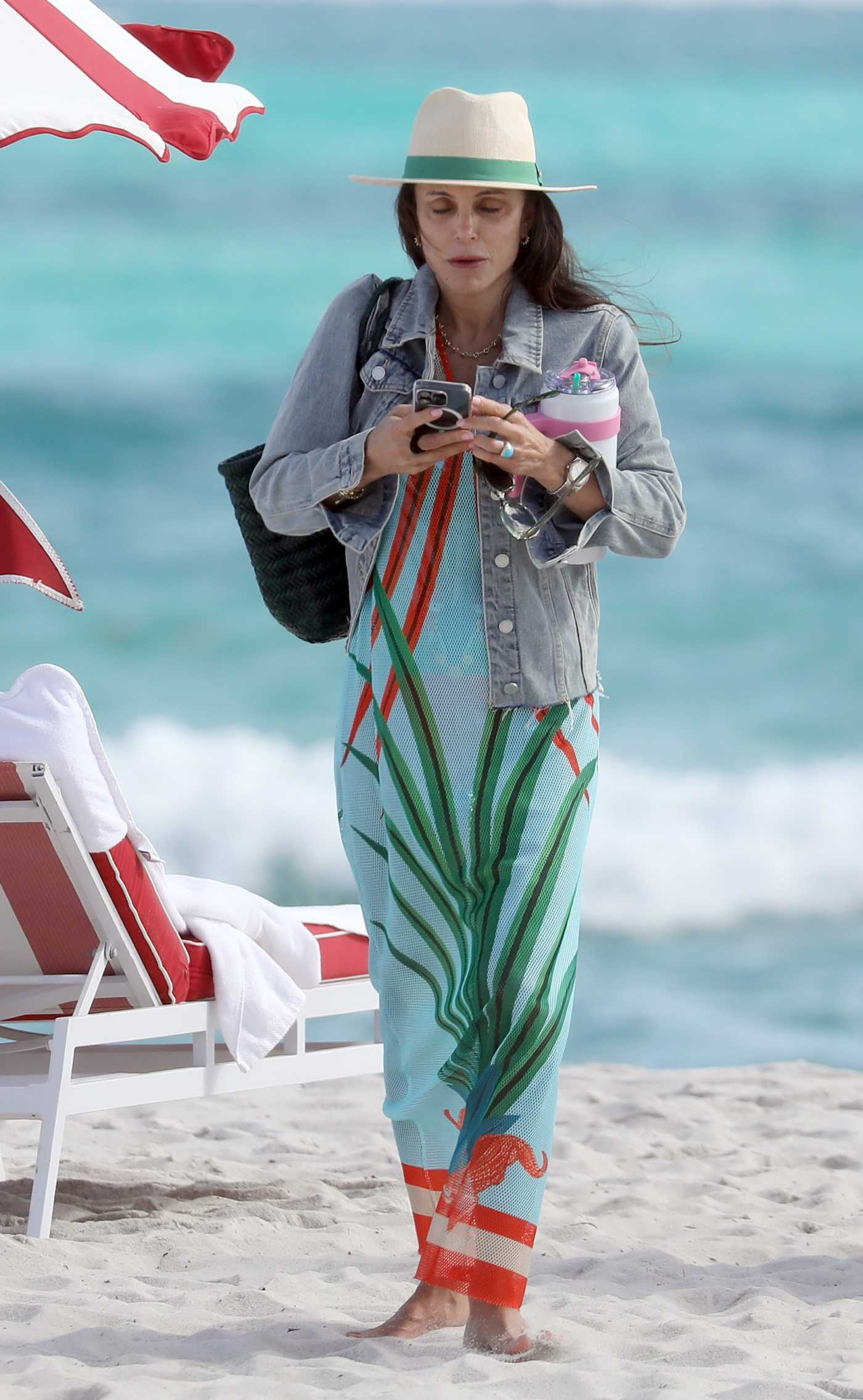 Bethenny Frankel in a Beige Hat Takes a Stroll on the Beach in Miami 12/08/2024