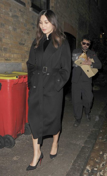 Gemma Chan in a Black Coat