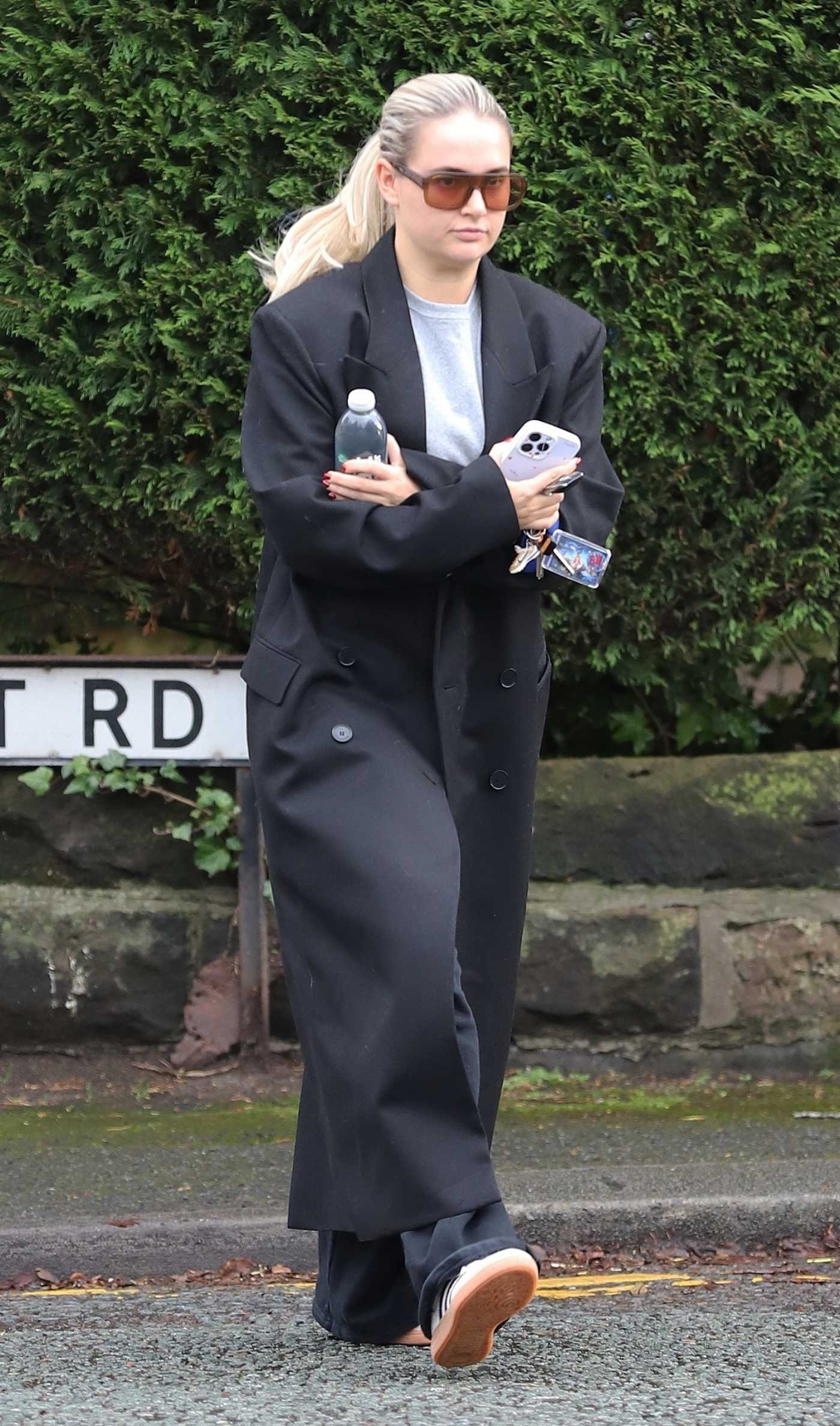 Molly Mae Hague in a Black Coat Arrives at Terence Paul Hairdressers in Hale on Christmas Eve in Manchester 12/24/2024