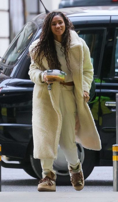 Vick Hope in a White Faux Fur Coat