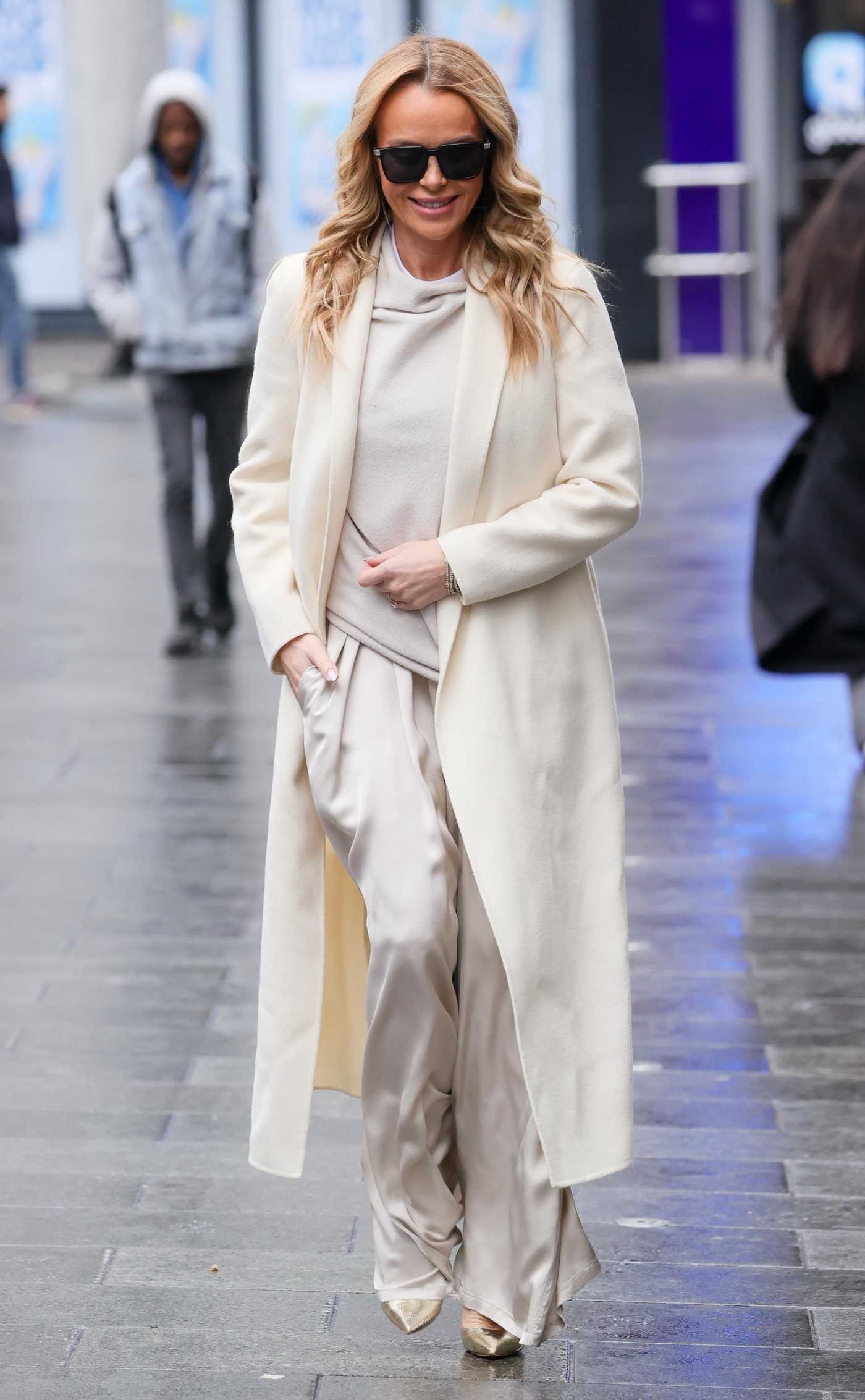 Amanda Holden in a White Coat Leaves the Heart Radio in London 01/23/2025