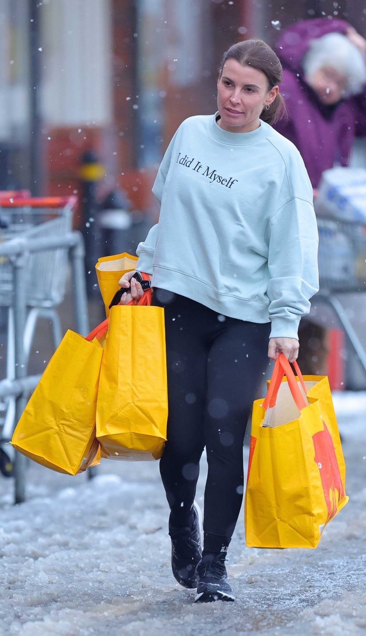 Coleen Rooney in a Baby Blue Sweatshirt Carrying Multiple Shopping Bags in Wilmslow 01/07/2025