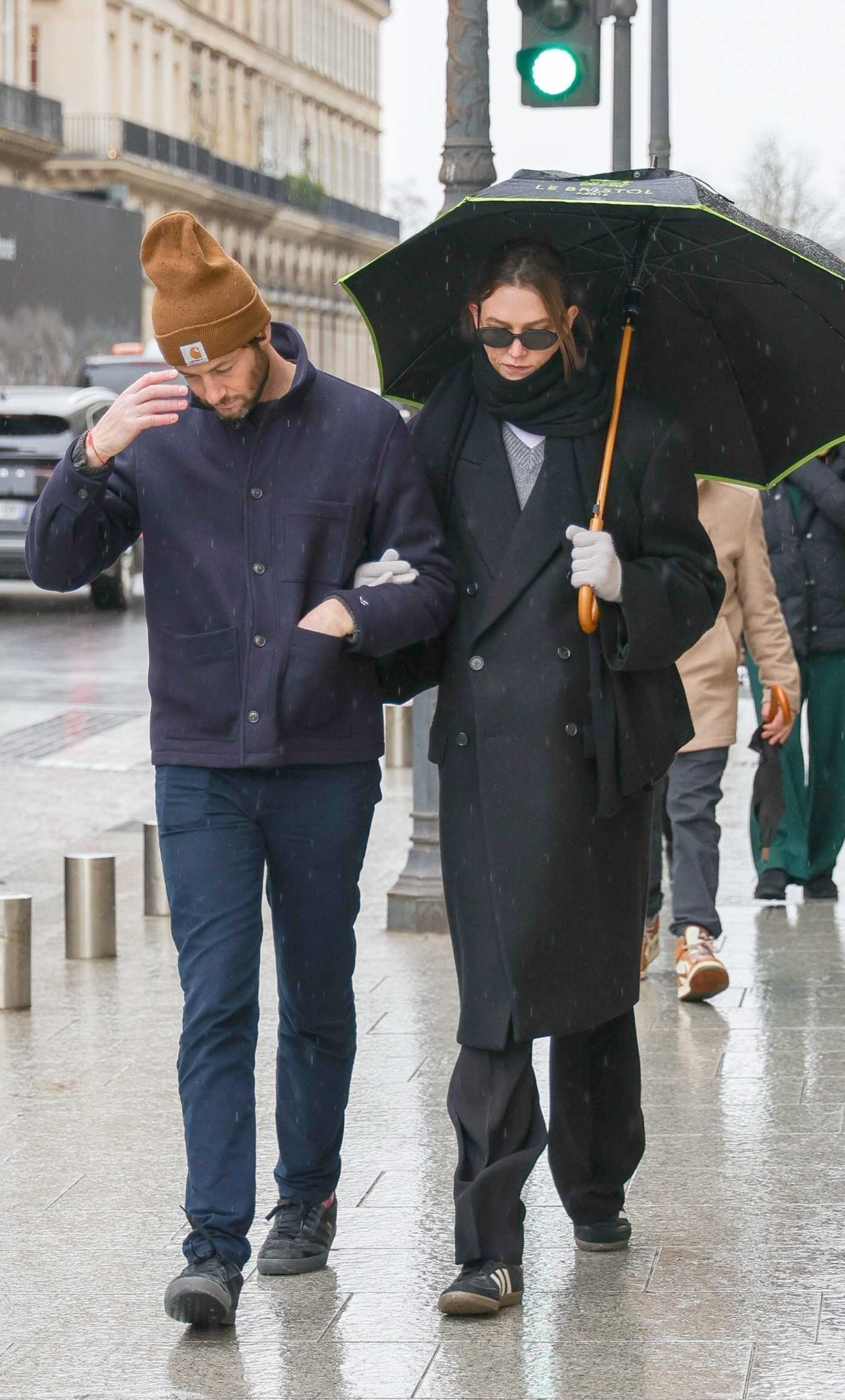 Karlie Kloss in a Black Coat Was Seen Strolling Through the Rain with Joshua Kushner in Paris 01/26/2025