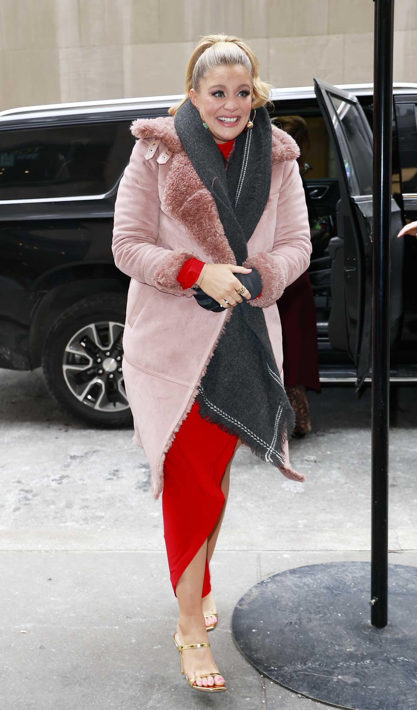 Lauren Alaina in a Pink Sheepskin Coat Arrives at NBC Rockefeller Building for Kelly Clarkson Show in New York City 01/21/2025