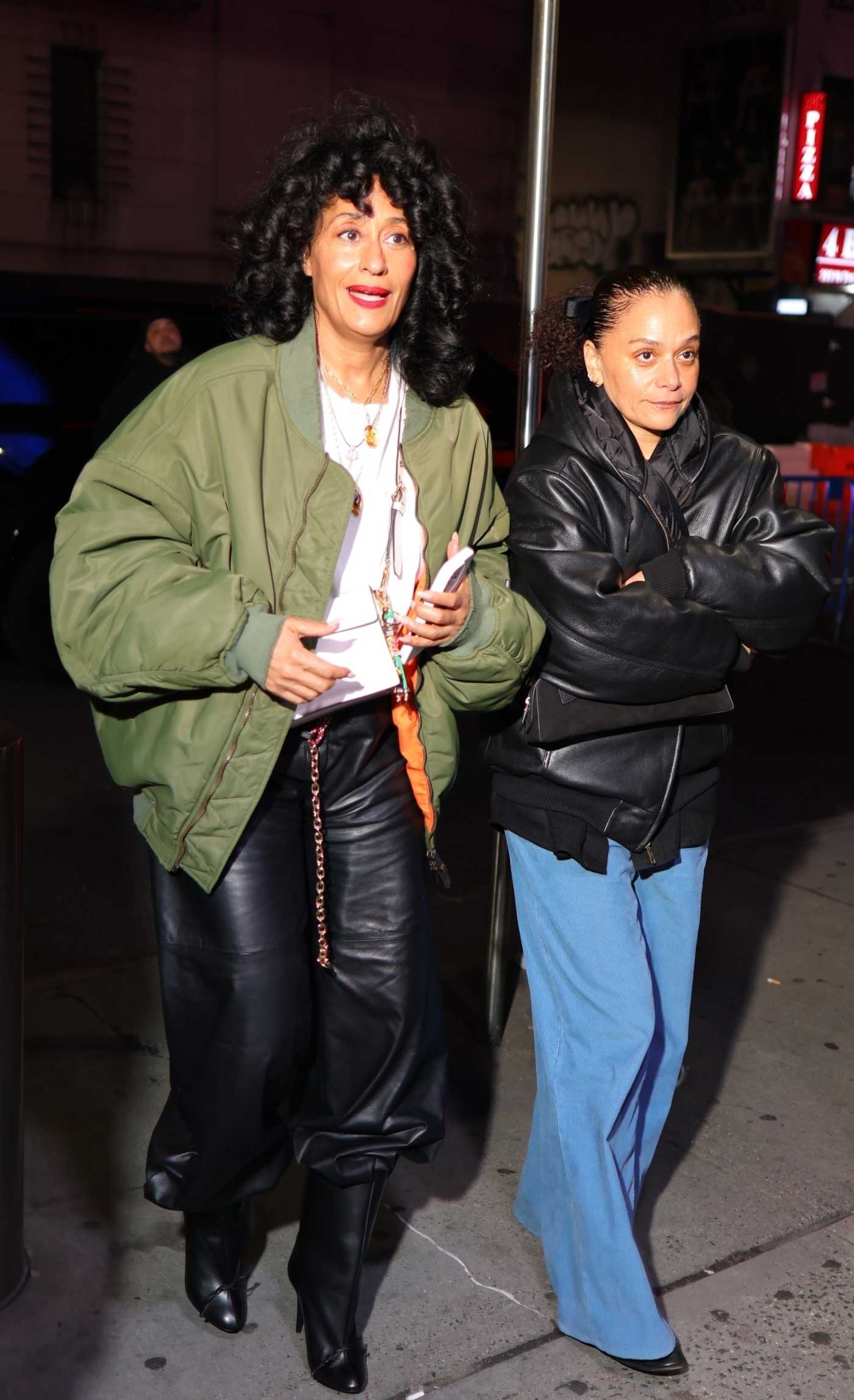 Tracee Ellis Ross in an Olive Bomber Jacket Arriving at Knicks Game with a Friend in New York 01/01/2025