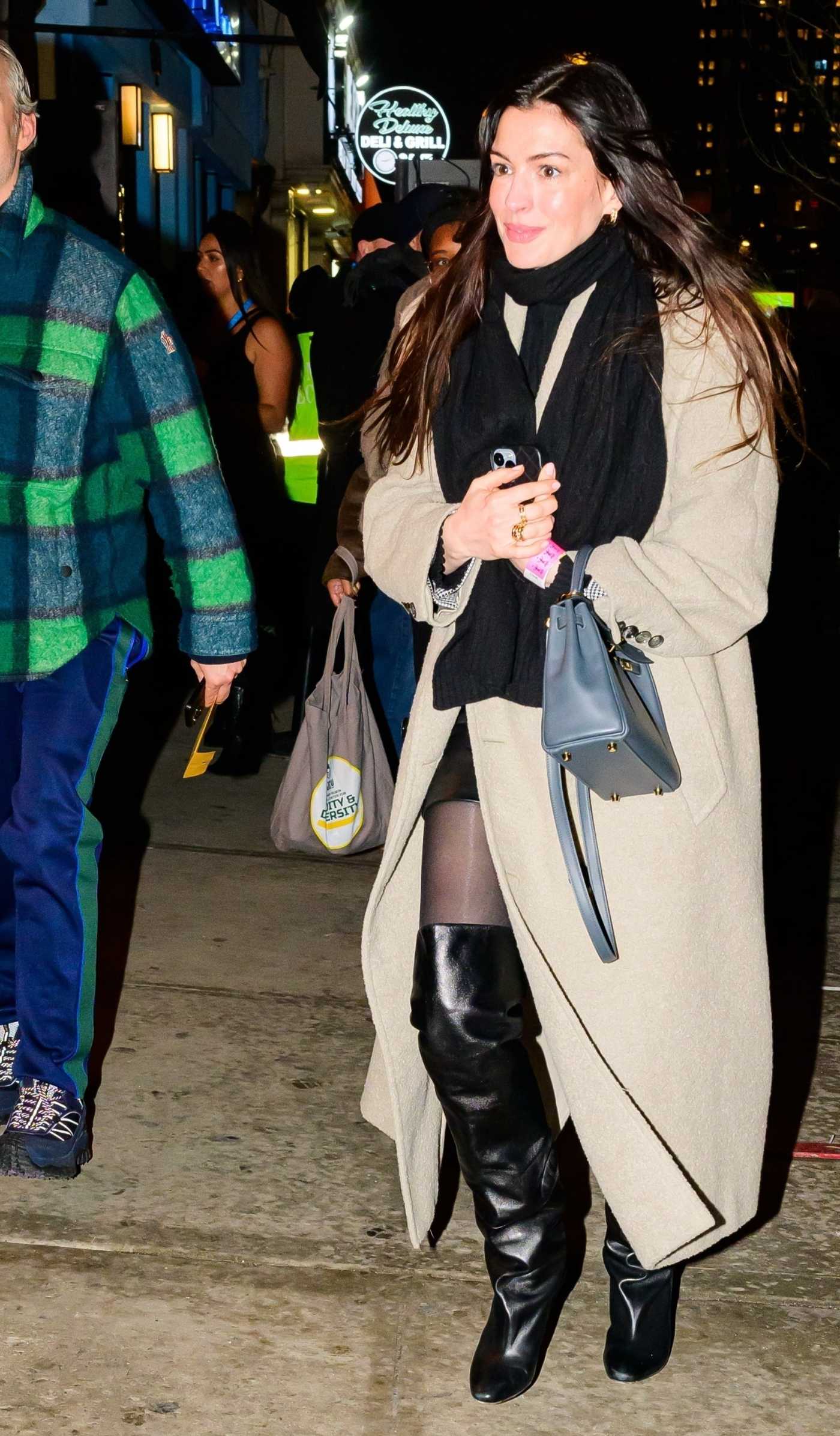 Anne Hathaway in a Beige Coat Leaves Paul McCartney's Concert in New York 02/12/2025