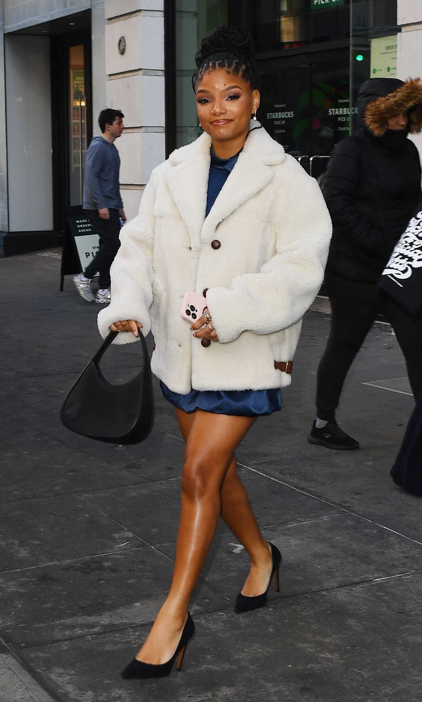 Halle Bailey in a White Fur Jacket Stops at Walgreen's in New York City 02/09/2025