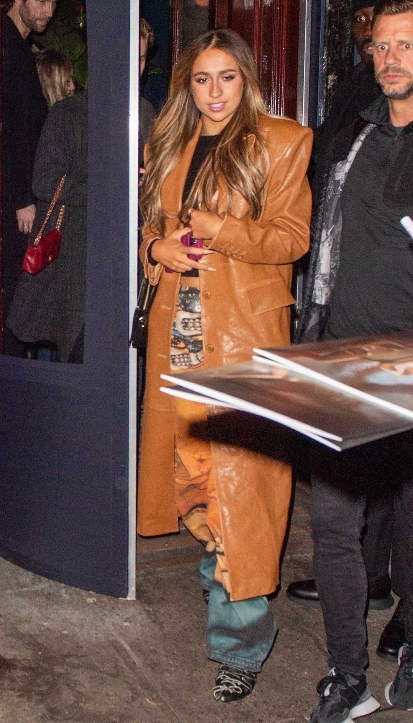 Tate McRae in an Orange Leather Coat Was Seen Out for Dinner at Carbone in New York 02/25/2025