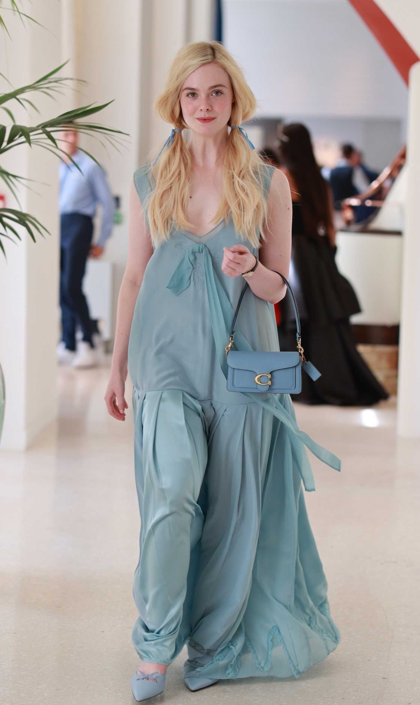 Elle Fanning in a Blue Dress Was Seen Out in Cannes 05/21/2025