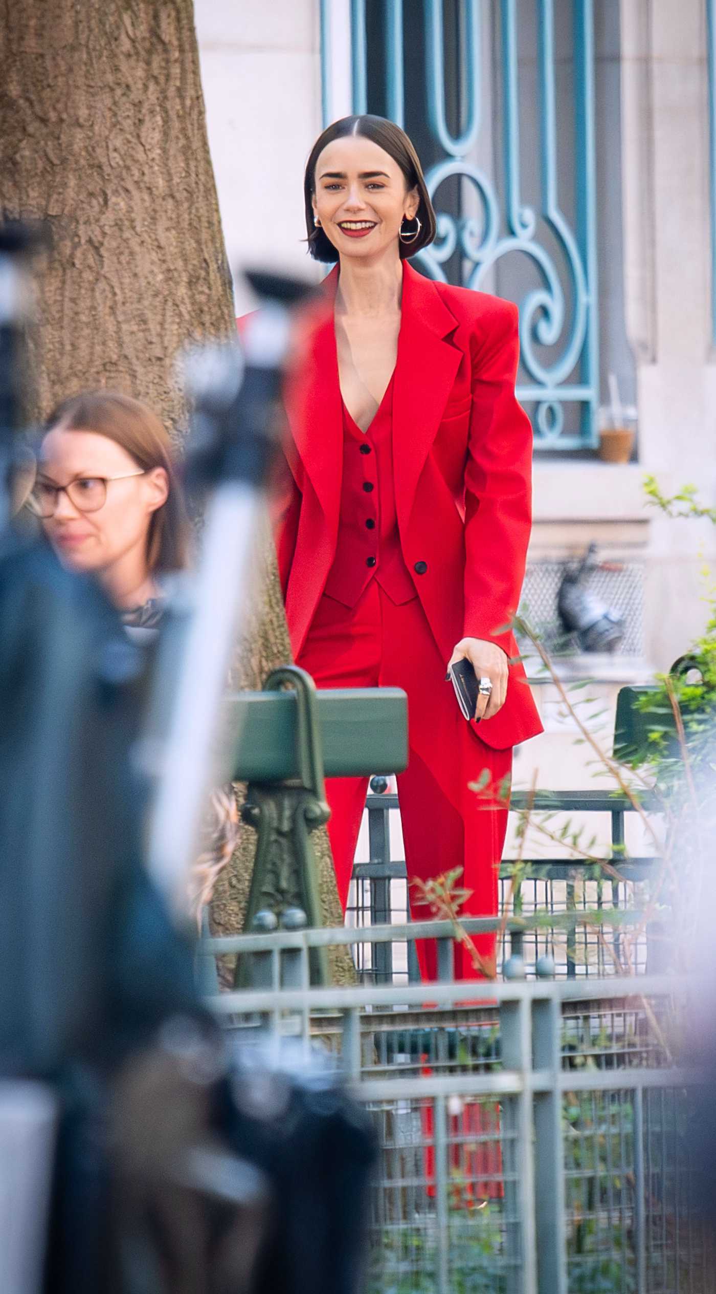 Lily Collins in a Red Ensemble on the Set of Emily in Paris in Paris 08/05/2025