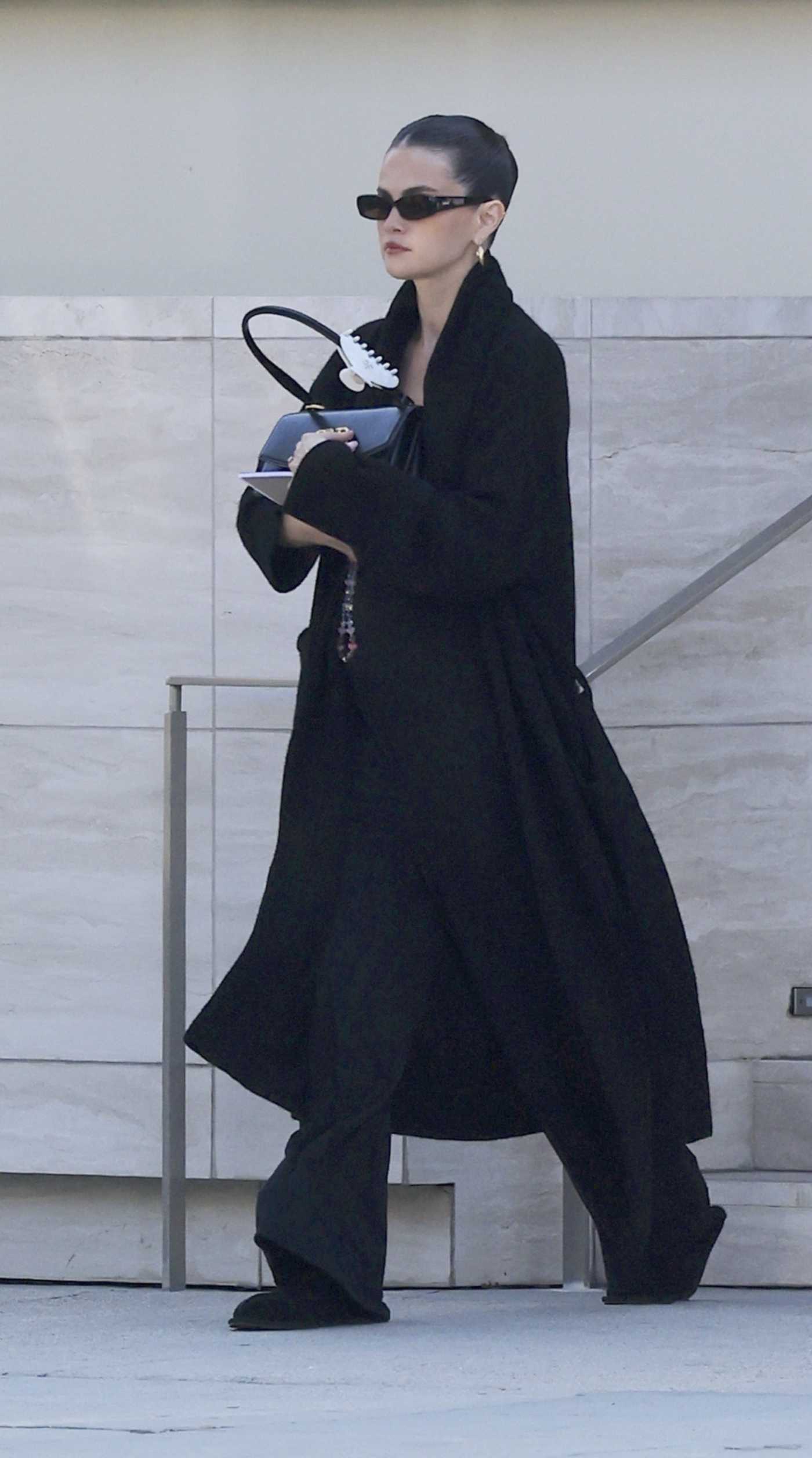 Selena Gomez in a Black Coat Exiting an Office Building in Los Angeles 08/13/2025