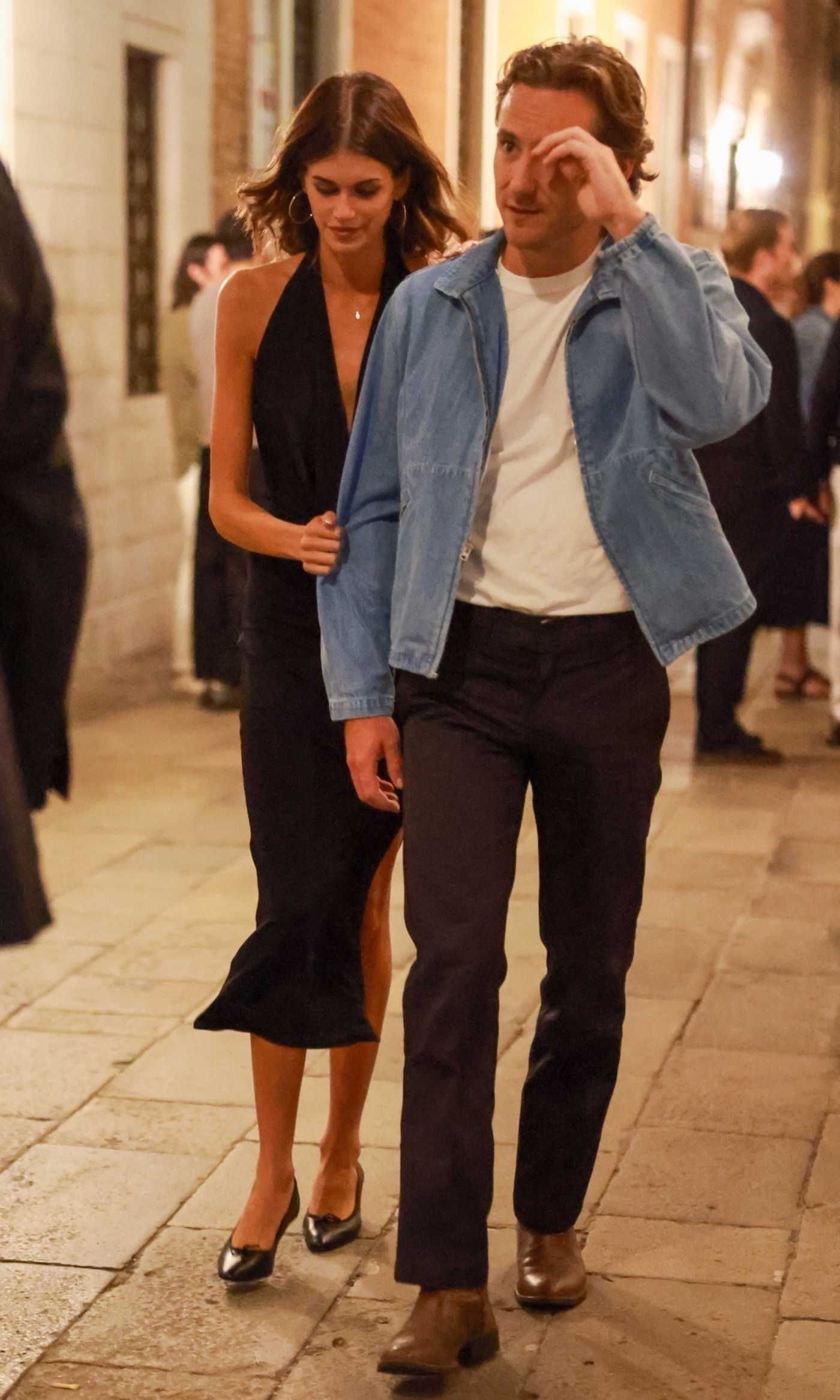 Kaia Gerber in a Black Dress Packs on the PDA with Lewis Pullman Out in Venice 08/31/2025