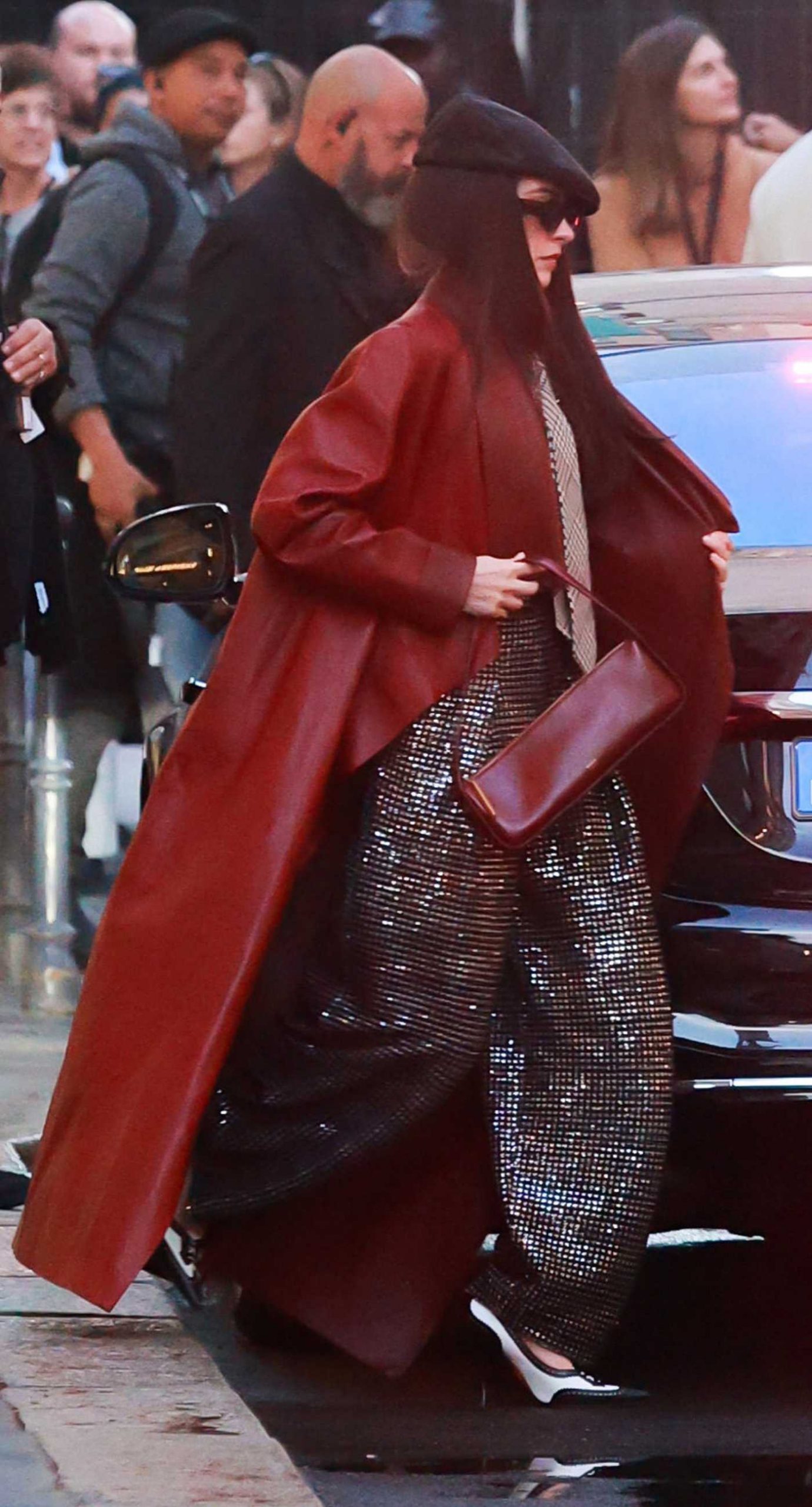 Anne Hathaway in a Black Cap on the Set of The Devil Wears Prada 2 in Milan 10/11/2025