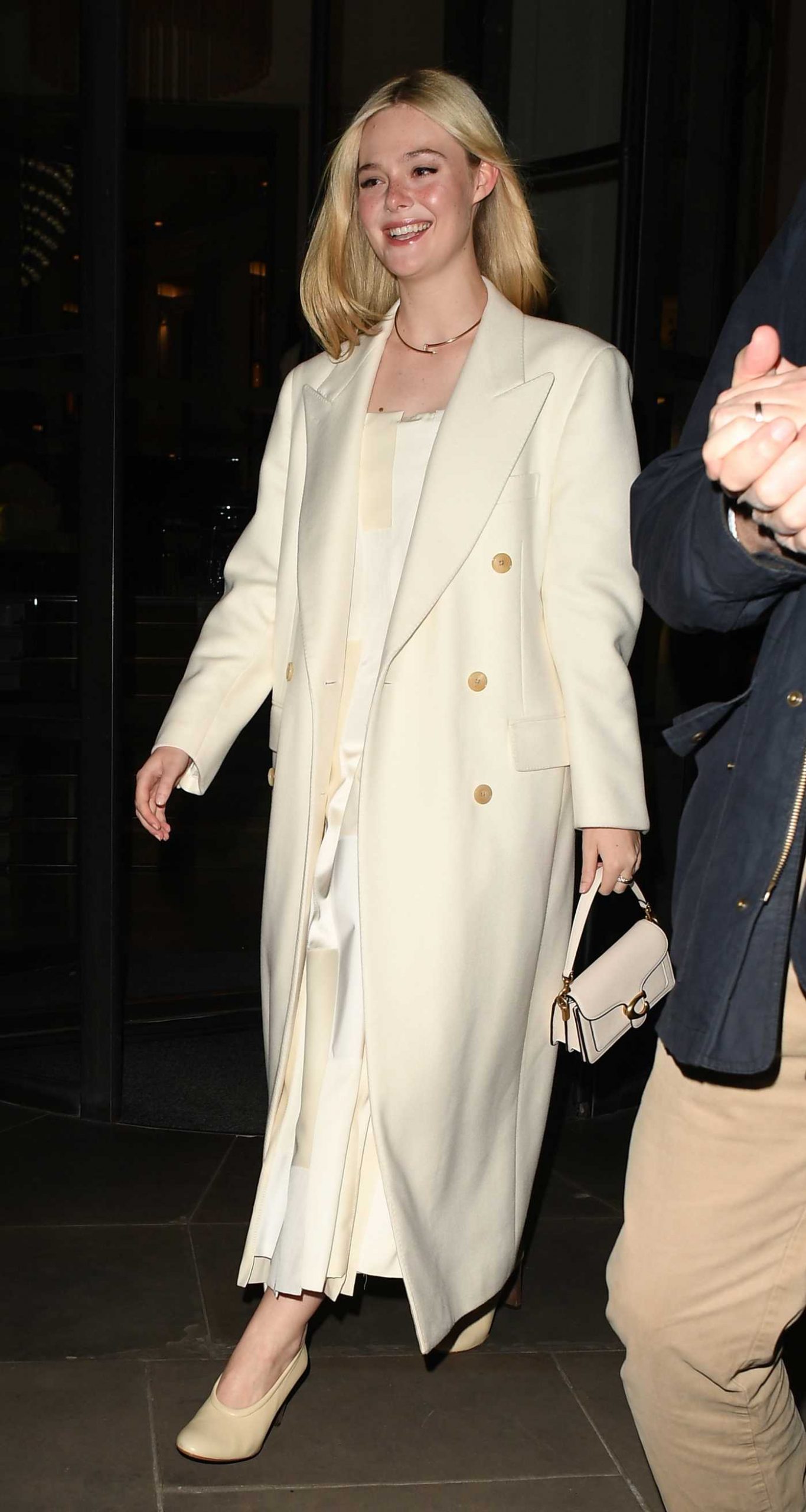 Elle Fanning in a Beige Coat Was Seen Outside of Her Hotel in Central London 10/28/2025