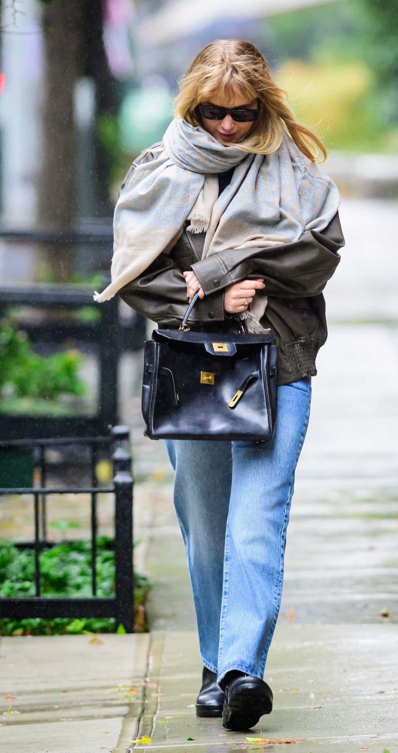 Jennifer Lawrence in a Blue Jeans Was Seen on a Rainy Day in New York City 10/13/2025