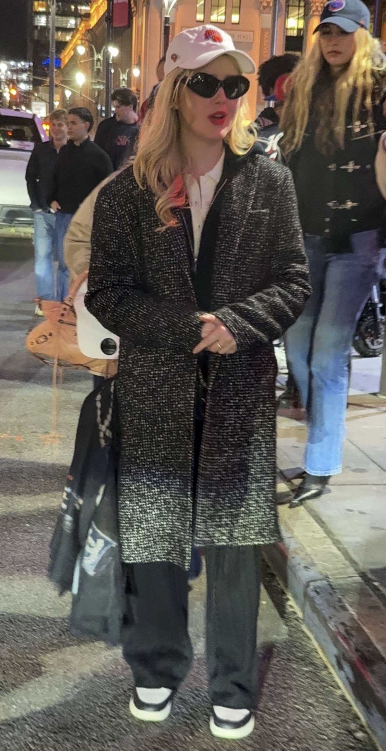 Kathryn Newton in a White Cap Leaves Madison Square Garden in New York 11/02/2025