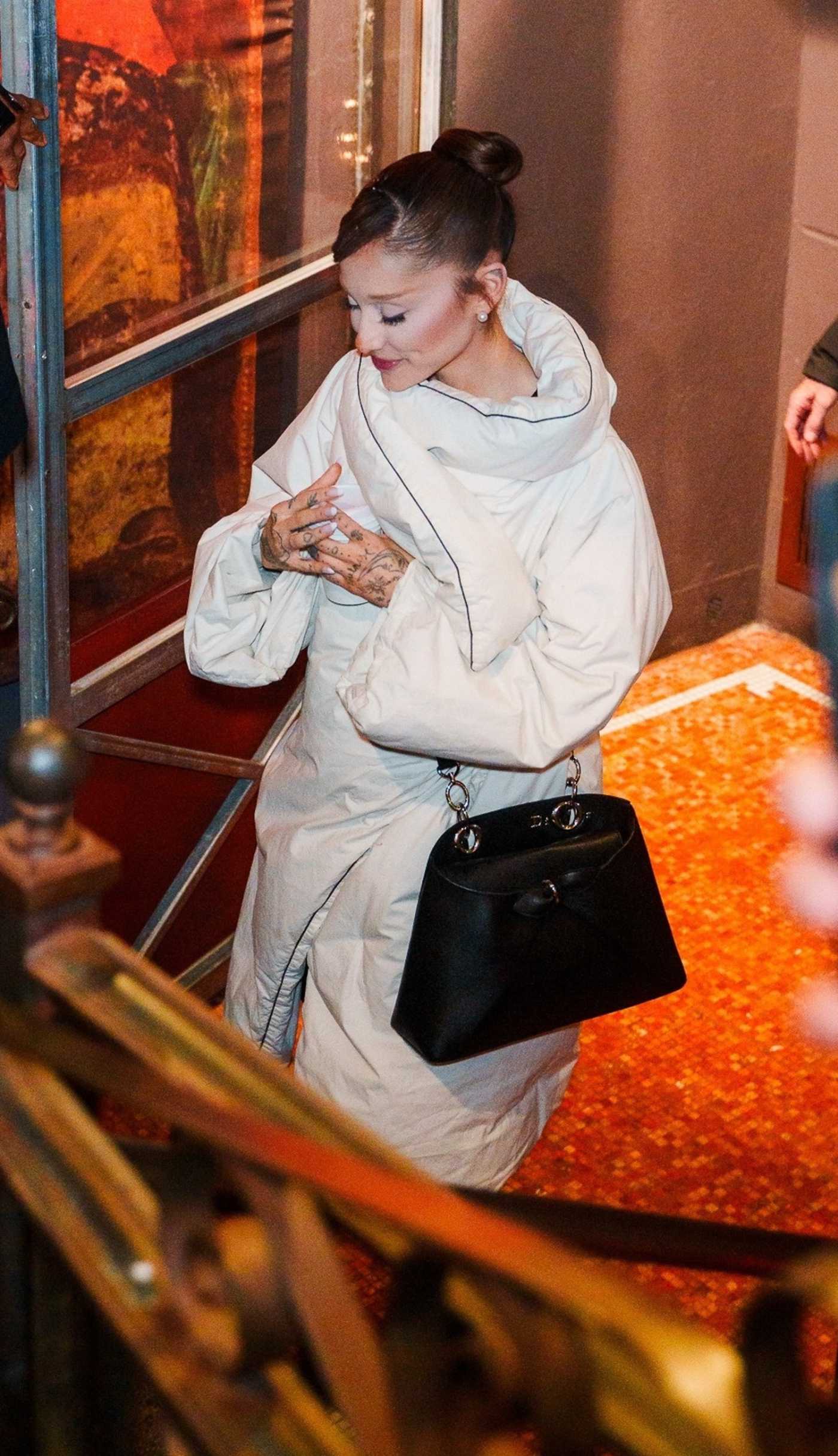 Ariana Grande in a White Puffer Coat Heading to SNL Dinner in New York City 12/16/2025