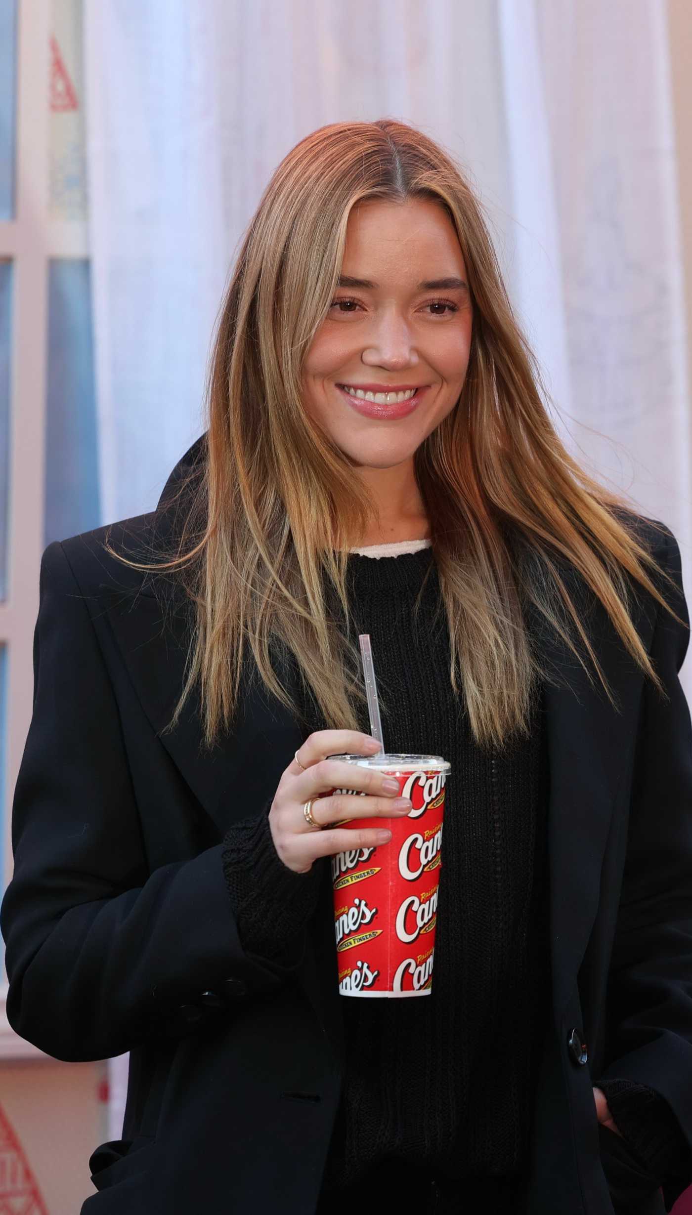 Olivia Ponton Attends Raising Cane's Annual Holiday Bike Giveaway Benefitting Harlem Boys and Girls Club at Times Square in New York City 12/03/2025