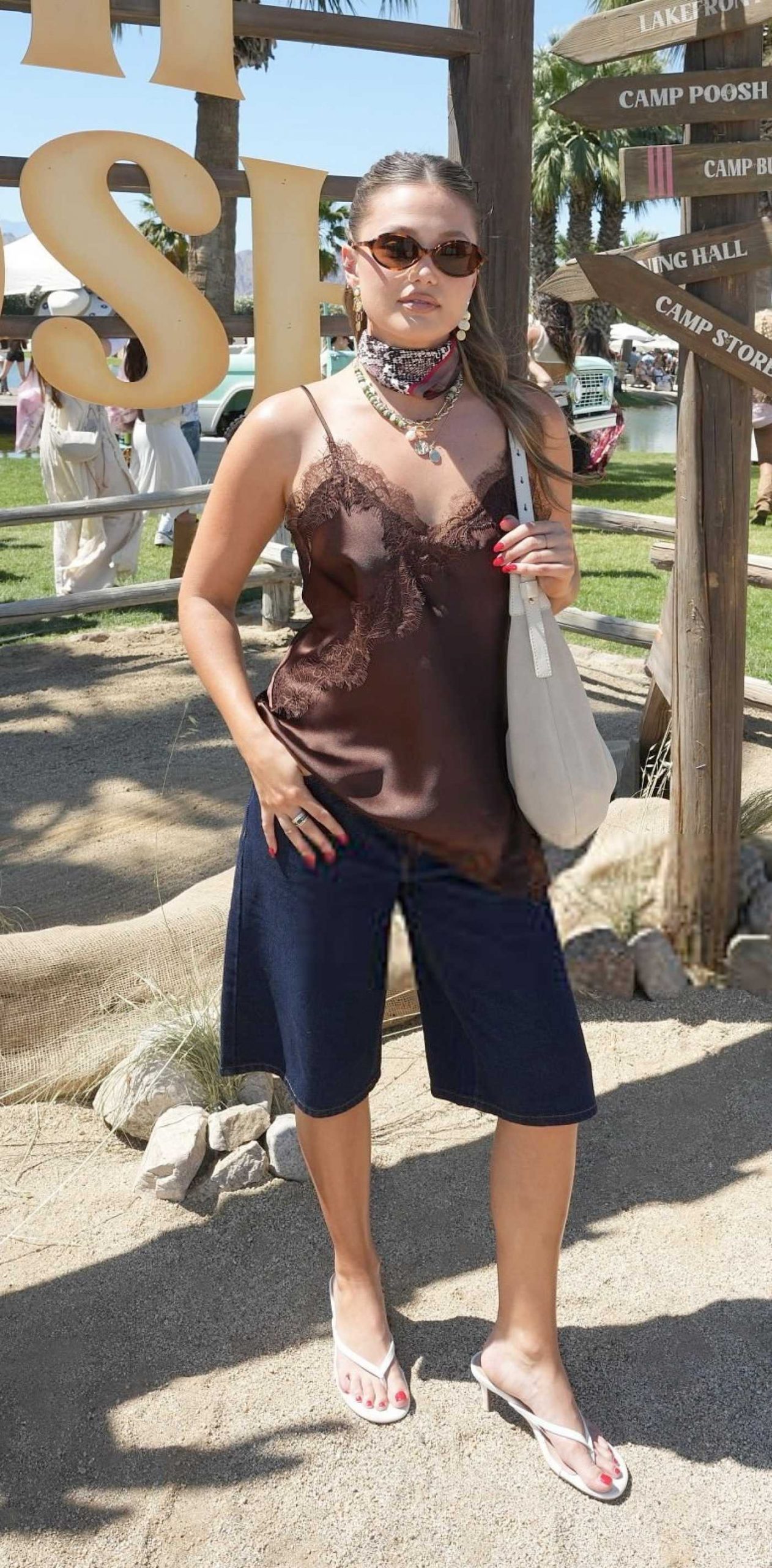 Olivia Holt Attends Camp Poosh in Indio 04/11/2026