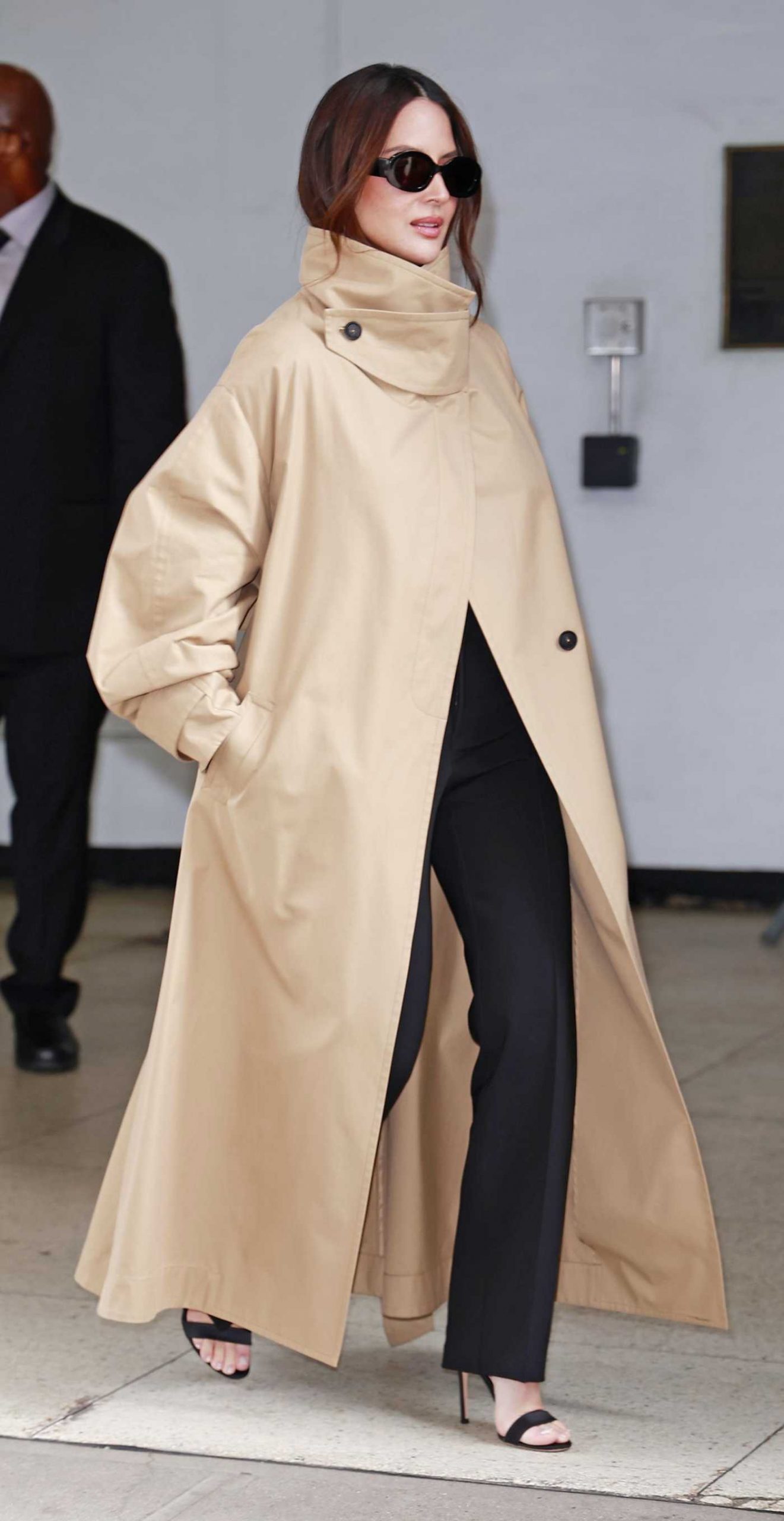 Olivia Munn in a Beige Trench Coat Was Seen Out of The Drew Barrymore Show in New York 04/01/2026