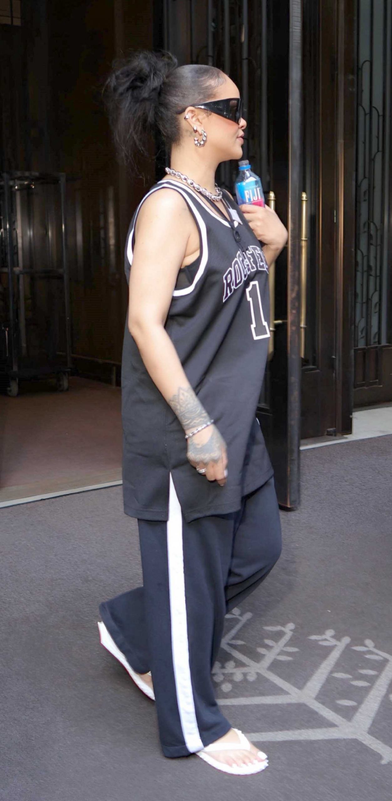 Rihanna in a Black Roc-A-Fella Jersey Heads to the Jay-Z Concert at Yankee Stadium in New York 07/12/2026