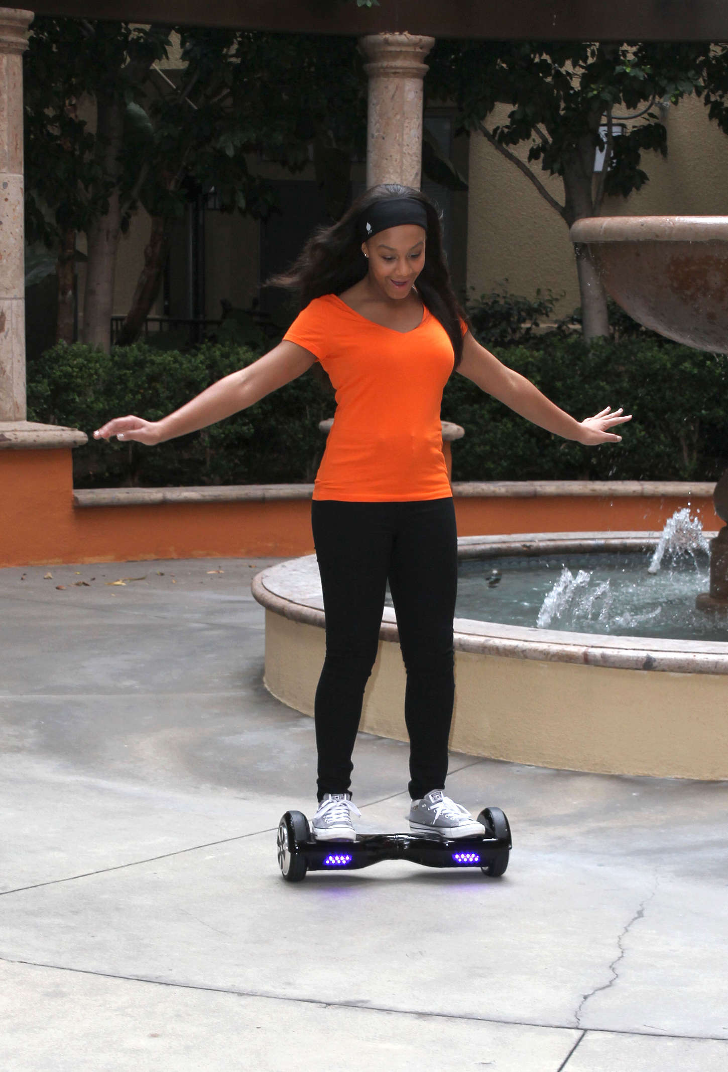 Nia Frazier Riding a self balancing board in Los Angeles